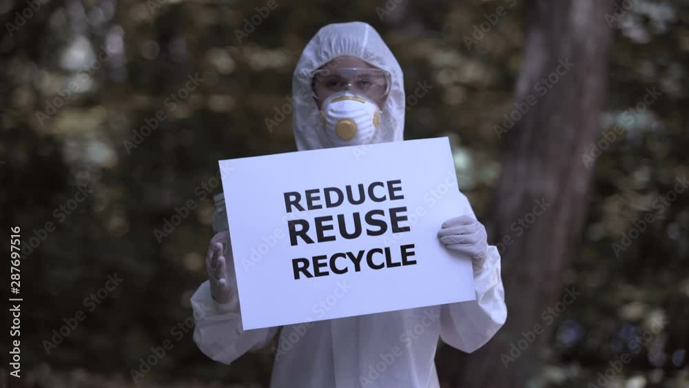 Reduce reuse recycle sign in female hands, chemist crumpling plastic ...