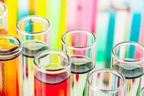 Test tubes with colorful chemicals close up in laboratory