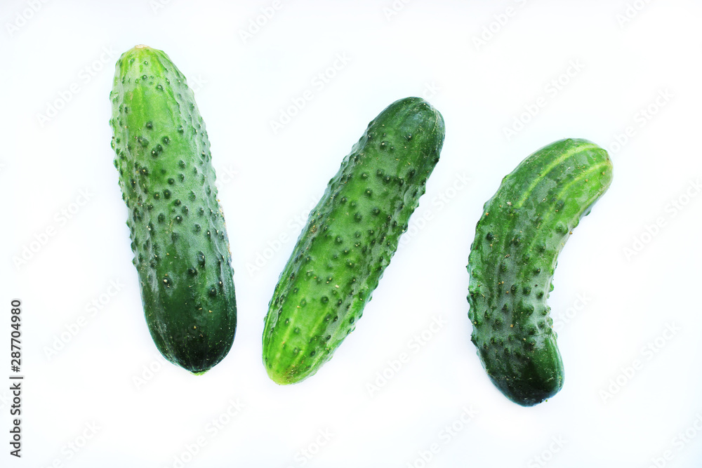 Three cucumbers without shadows on a white background. Three cucumbers without shadows on a white background.
