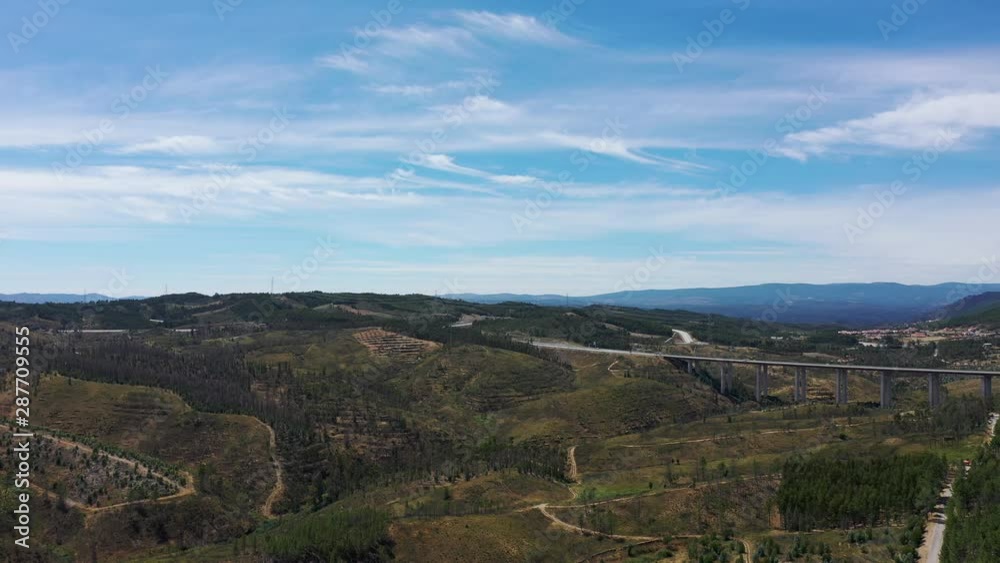Bridge on the mountains. Highway crossing the mountains with a beautiful sky. Shot by drone at Portugal Bridge on the mountains. Highway crossing the mountains with a beautiful sky. Shot by drone at Portugal