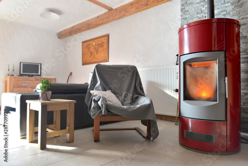 Slika na platnu red stove pellet in a living room