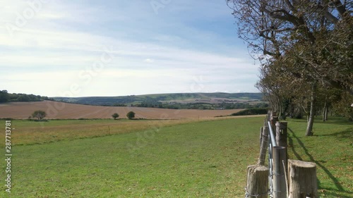 The South Downs, England. 4K video footage summer view over the rural countryside of the South Downs national park, Sussex, south of England, on a sunny but breezy day.