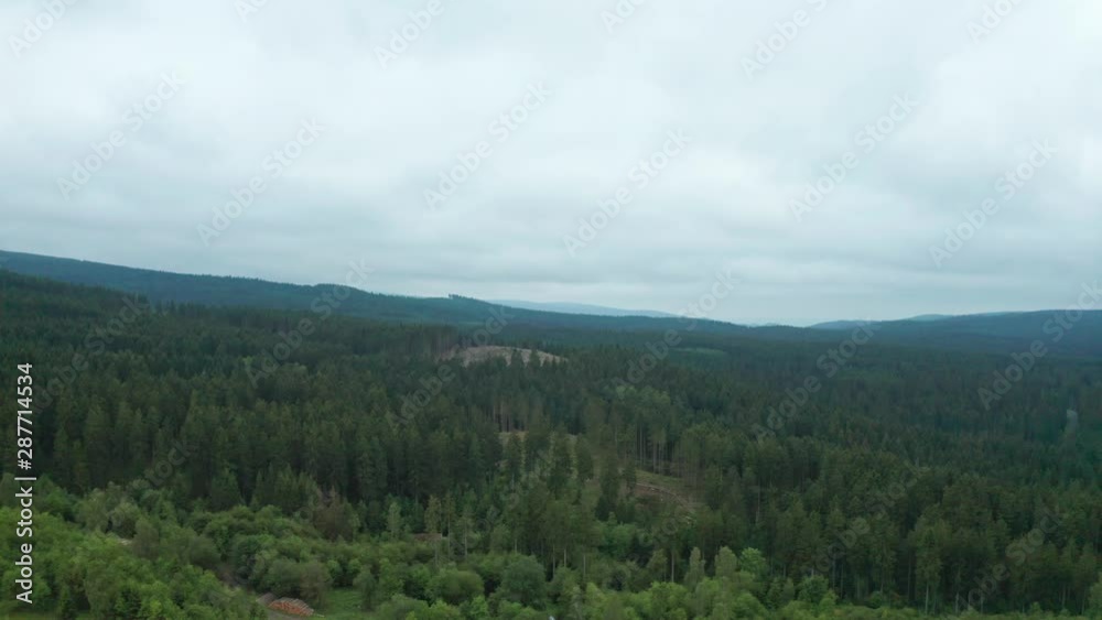 Aerial flight with view over german forest Aerial flight with view over german forest
