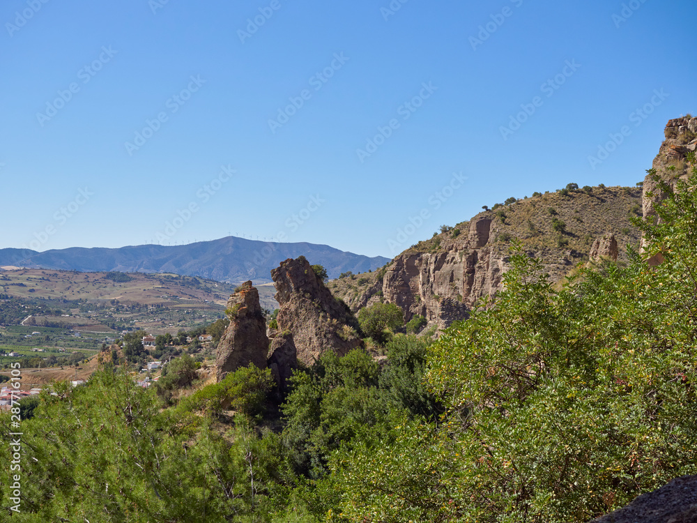 Rocky Outcrops detached from the Towering Cliffs at the Raja Ancha Recreation Park near Pizarra, Andalucia on an April Afternoon. Spain.