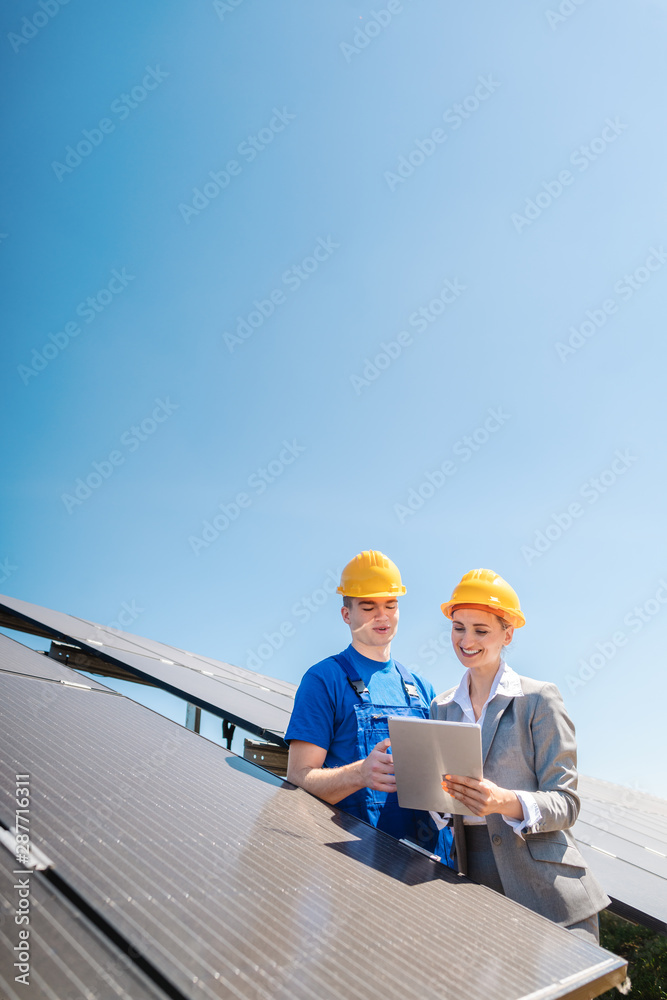 Manager and worker in photovoltaic power plant Manager and worker in photovoltaic power plant