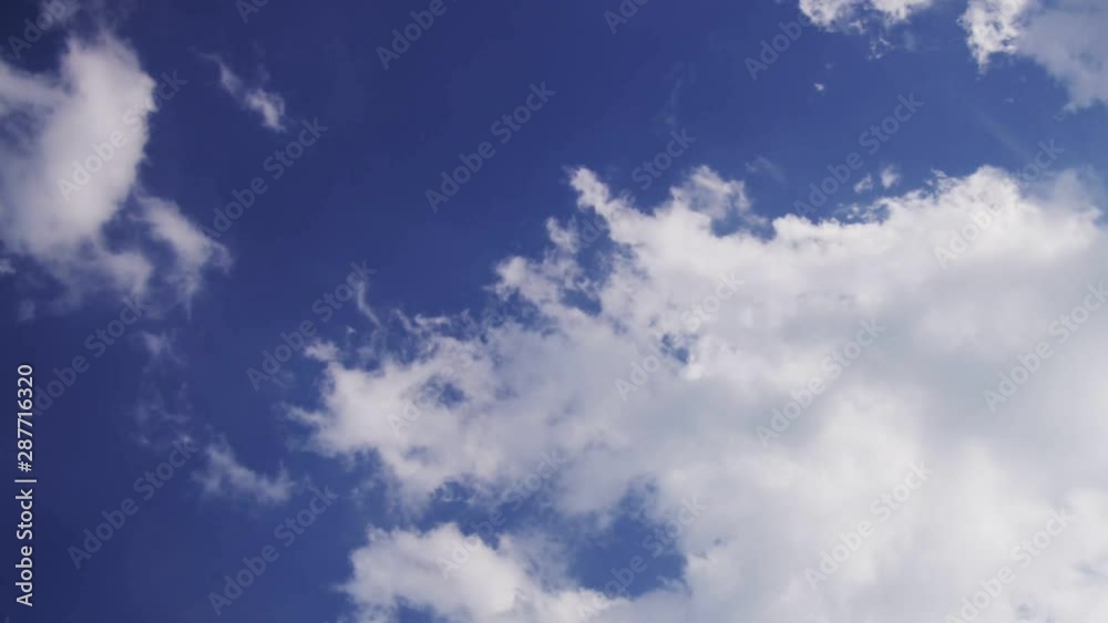 PUFFY CLOUDS, Puffy fluffy white clouds blue sky time lapse motion background. Bright blue sky puffy fluffy white cloud cloudscape cloudy heaven. Puffy fluffy white cloud blue sky background. PUFFY CLOUDS, Puffy fluffy white clouds blue sky time lapse motion background. Bright blue sky puffy fluffy white cloud cloudscape cloudy heaven. Puffy fluffy white cloud blue sky background.