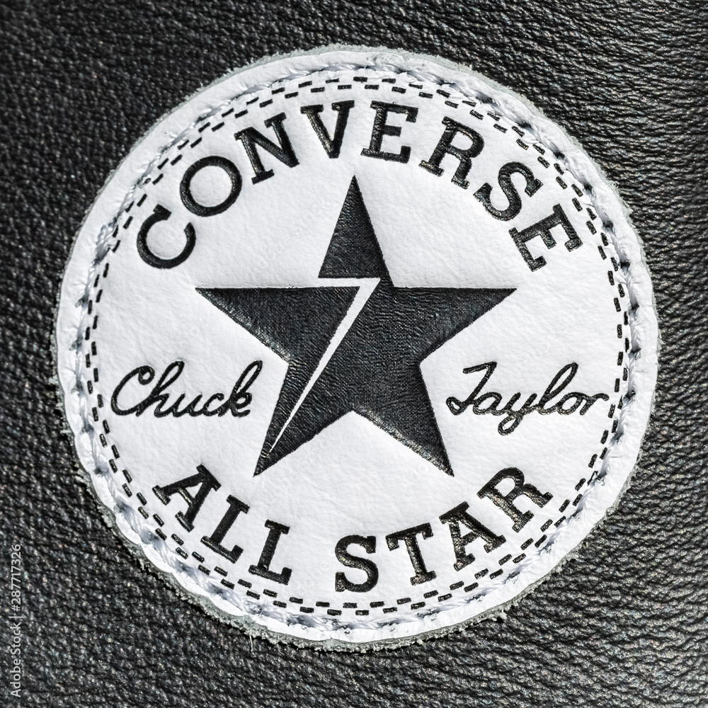 Chartres, France - September 2, Close-up of the logo of All Star Converse sneakers seen on a leather surface foto de Stock | Adobe