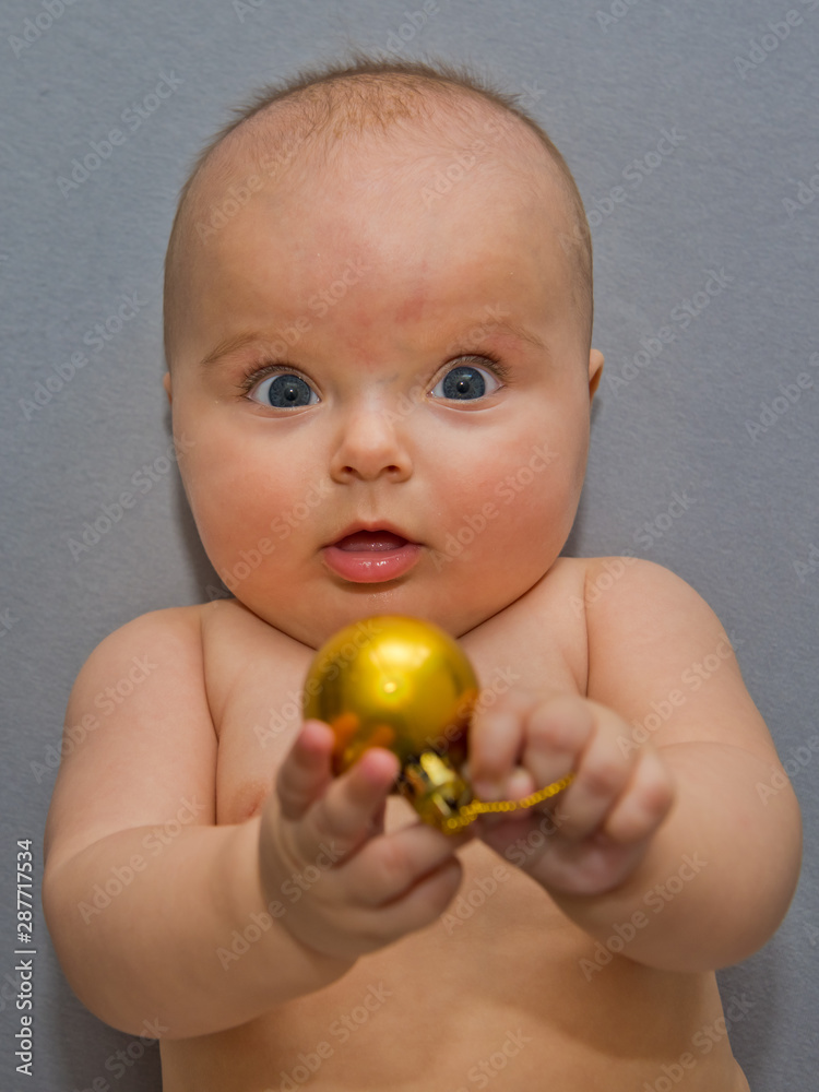 Portrait of a child who plays a Christmas ball. Portrait of a child who plays a Christmas ball.