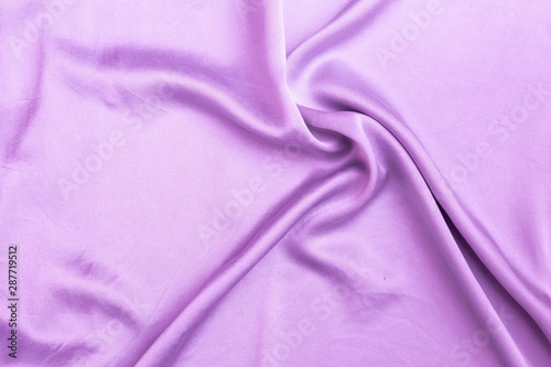 Abstract waving purple satin fabric background, blank purple fabric pattern background
