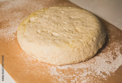Yeast dough on the table. Baking concept. Cooking ideas. Homemade food. Knead flour and water.