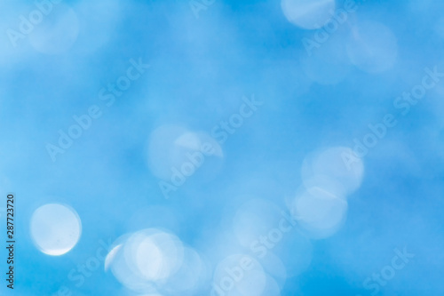 abstract background in blue colors light reflected in water looks weird with air bubbles and bokeh  with blur