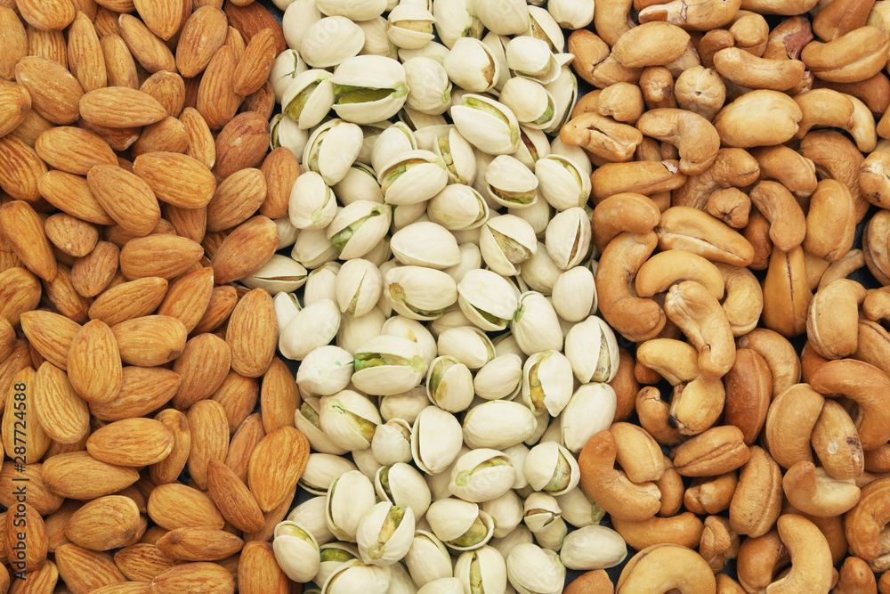Nuts background, pistachio, almond and cashew nuts Nuts background, pistachio, almond and cashew nuts