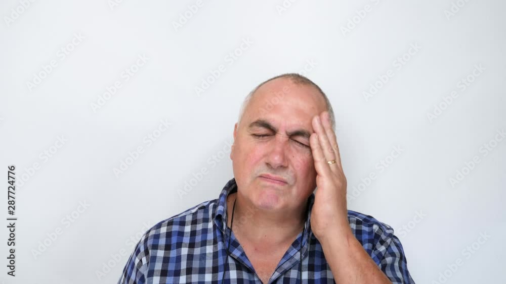 Middle aged man with headache isolated on white background Middle aged man with headache isolated on white background