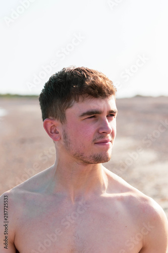 Shirtless on a beach