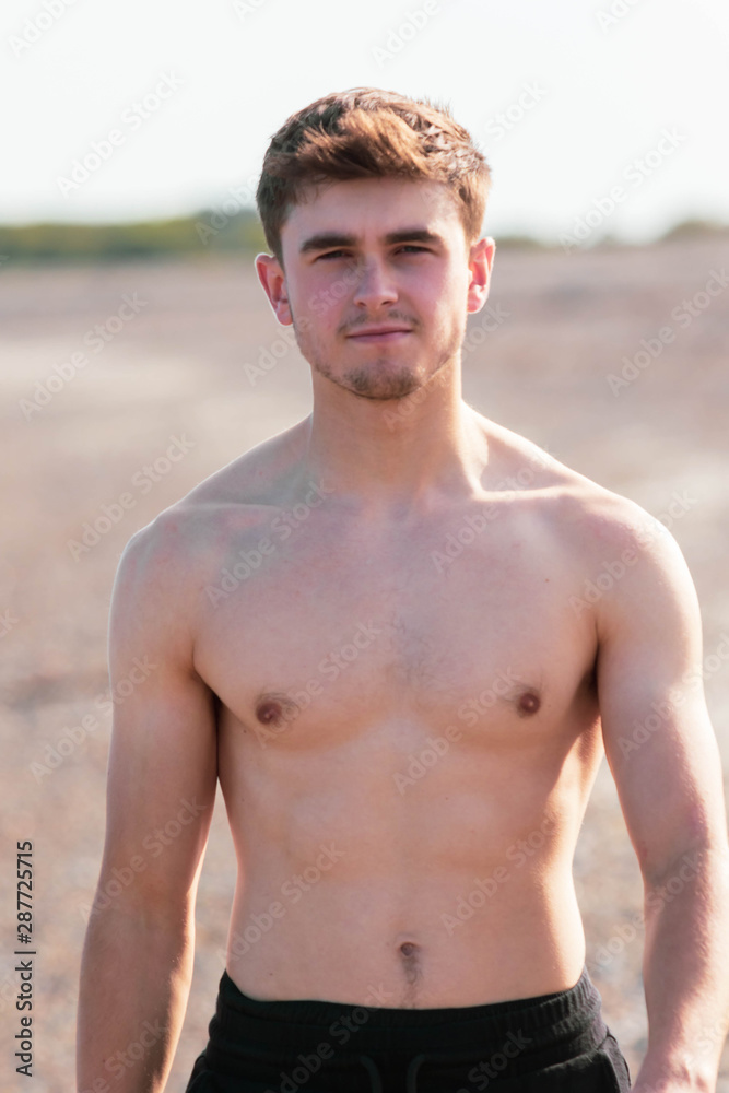 Obraz premium Shirtless on a beach