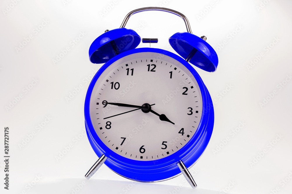 Blue retro alarm clock isolated on white, Time concept Blue retro alarm clock isolated on white, Time concept