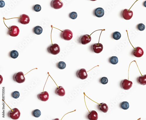 Cherries and blueberries on the white background  seamless pattern