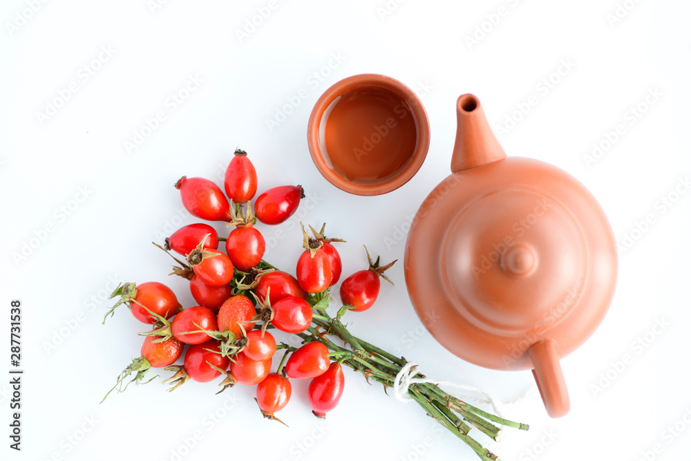 herbal tea with rose hips isolated on white, Medicinal plants and herbs composition