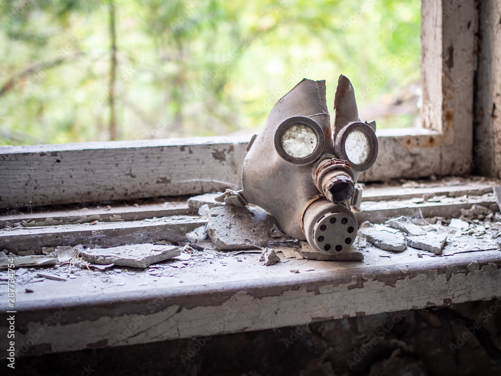 Old children's gas mask inside of the abandoned Pripyat Elementary School No. 3 in Pripyat city, Chernobyl Exclusion Zone, Ukraine Stock Adobe