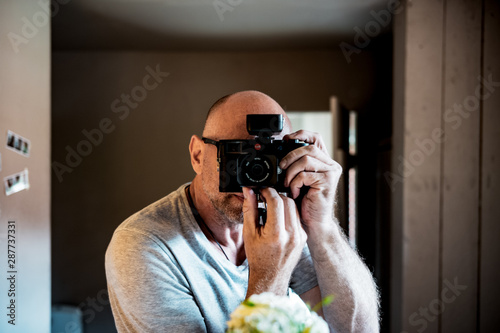 young man with a leica camera photo