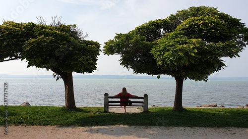 couple sitting on bench in park