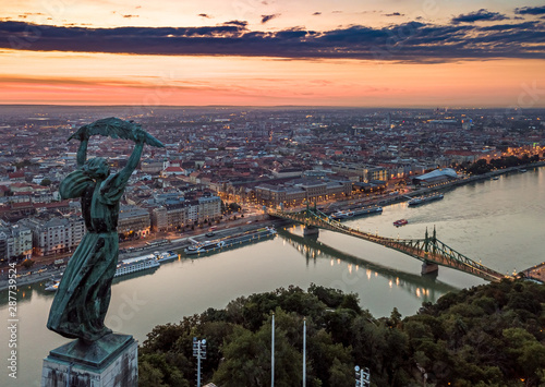 Budapest, Hungary - Aerial panoramic sunrise view with Statue of Liberty ,Liberty Bridge on River Danube taken from Gellert Hill