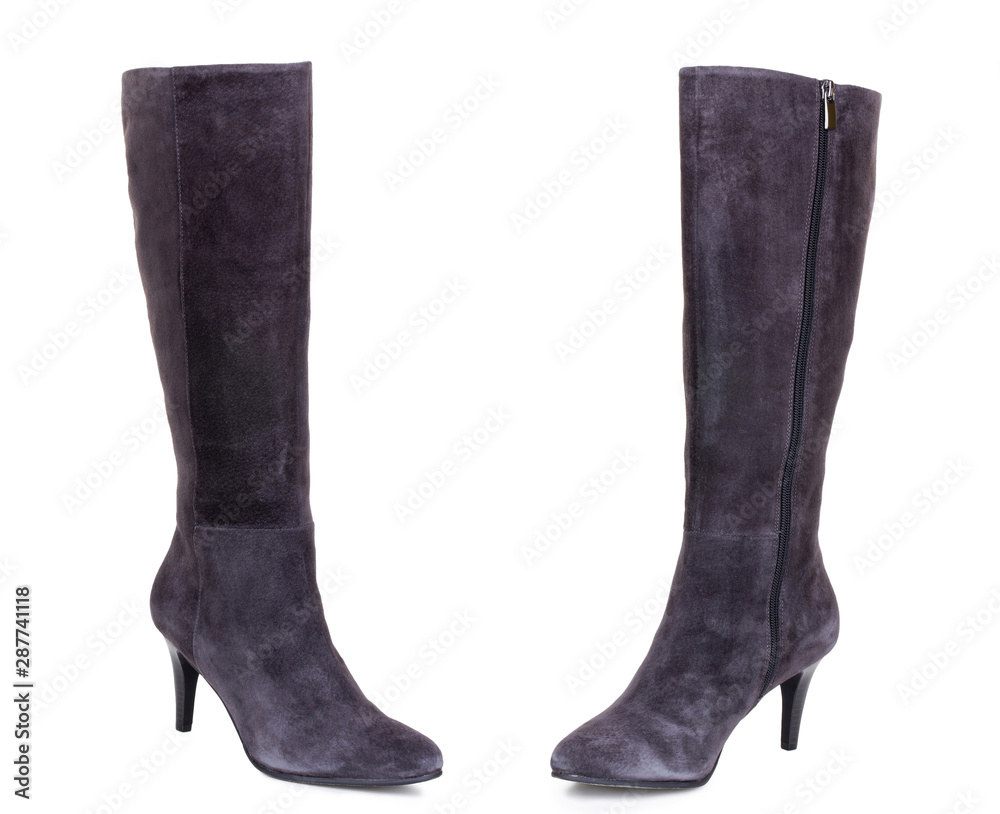 Classic grey brown suede leather high knee ankle heels female boots. Two isolated Classic grey brown suede leather high knee ankle heels female boots. Two isolated