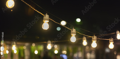 party string lights hanging over outdoor restaurant terrace