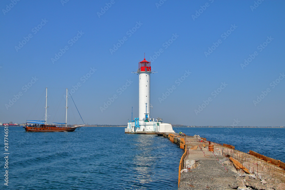 Walking brig sailing near the Odessa lighthouse.