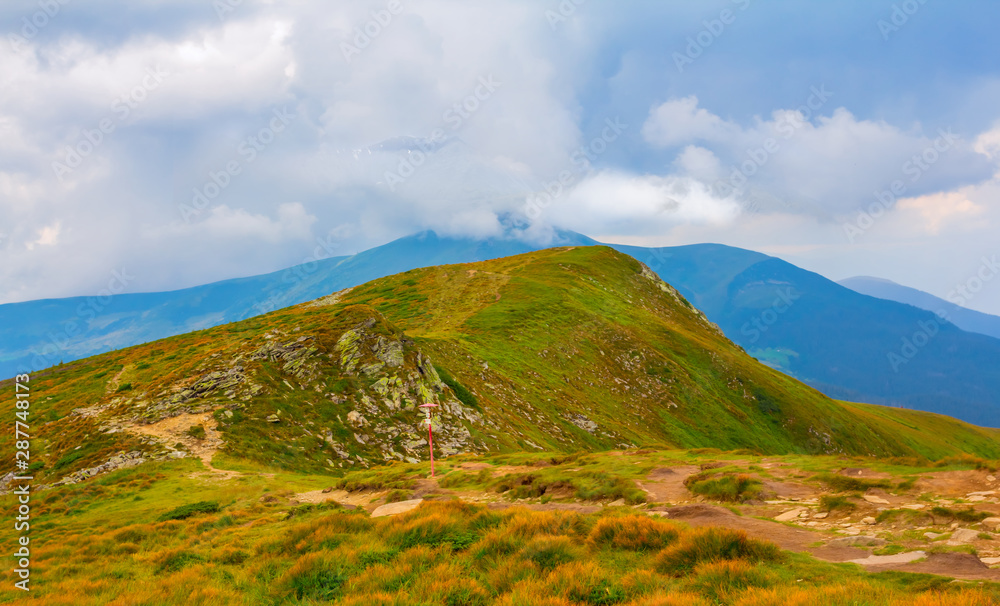 green mountain ridge in a dense clouds and mist green mountain ridge in a dense clouds and mist