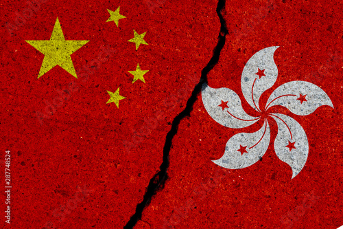Canvas Print china and hong kong flags painted over cracked concrete wall