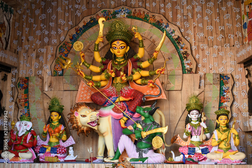 Idol of Goddess Devi Durga at a decorated puja pandal in Kolkata, West Bengal, India. Durga Puja is a famous and major religious festival of Hinduism that is celebrated throughout the world. photo