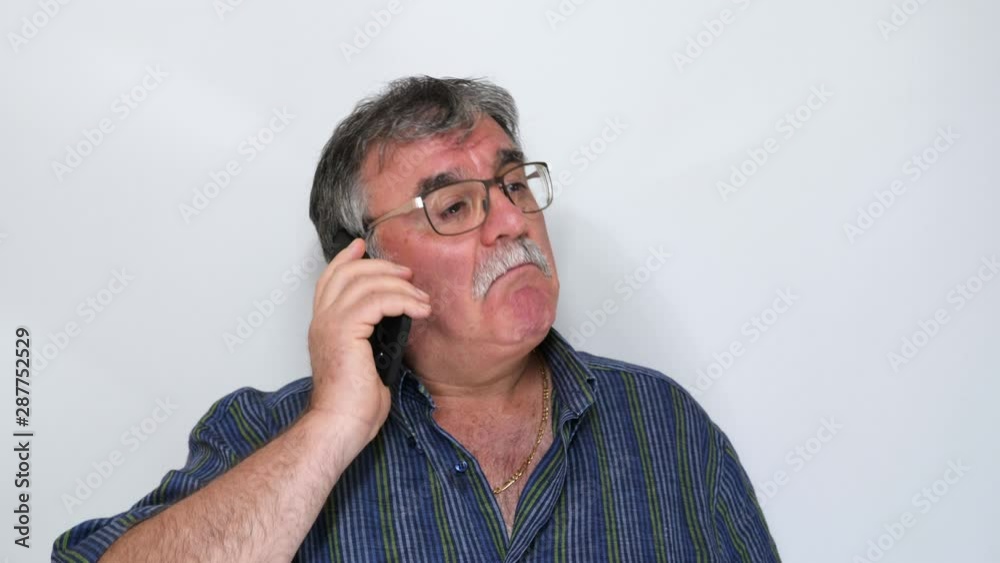 Mature man using smartphone on white background. Mature man using smartphone on white background.
