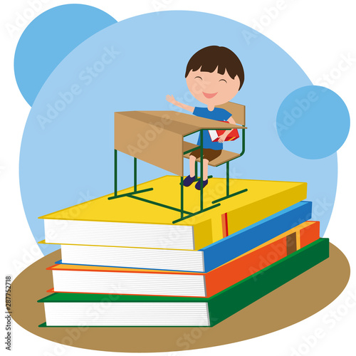 Back to school. Boy sits at...