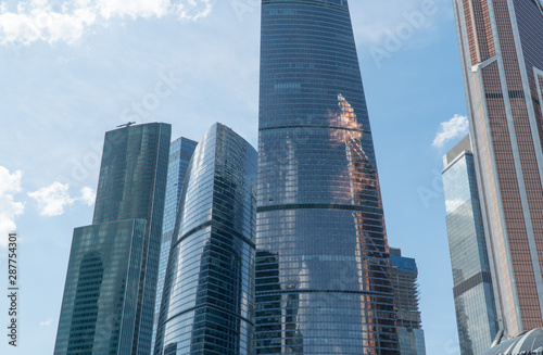 High rise buildings of the business center of Moscow. District Moscow-city against the day sky with clouds