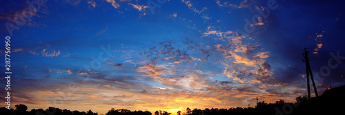Panoramic view of sunset above village