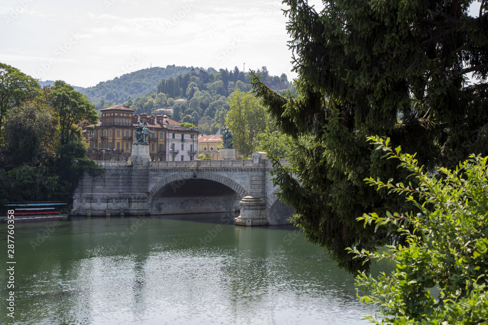 Fototapeta premium The Vittorio Emanuele bridge over the river Po in Turin, Italy