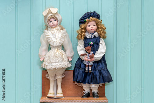 A doll in a bunny suit and a doll in a blue dress and blue cap © Andrey Nikitin