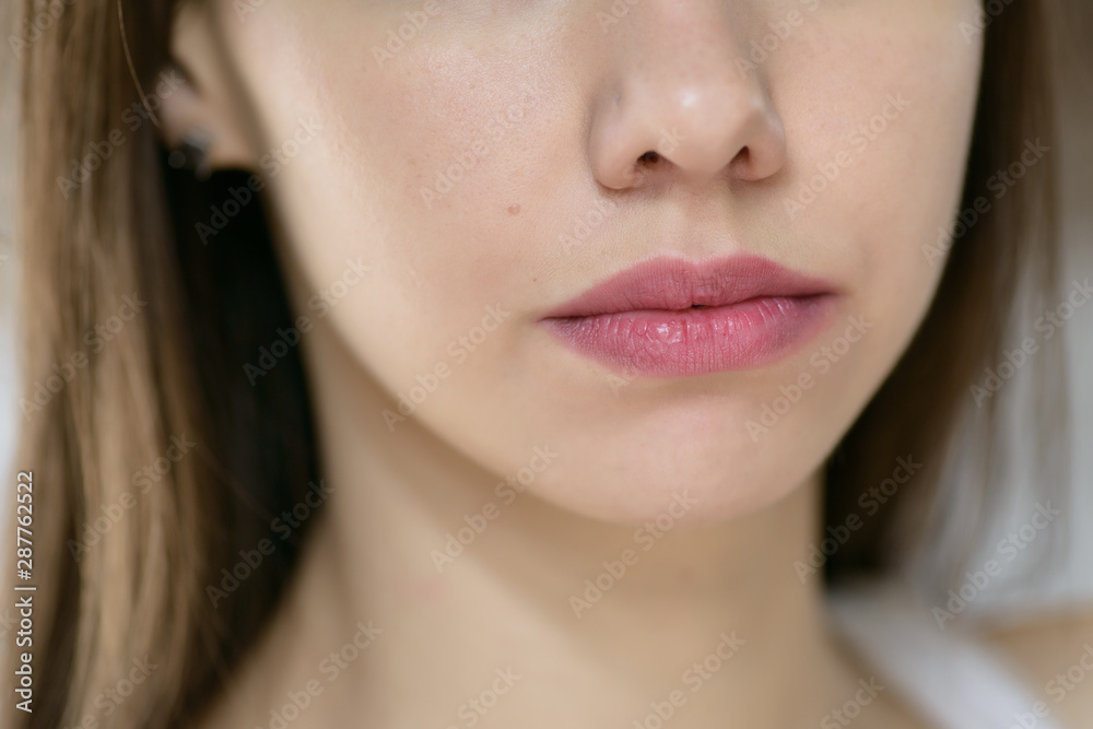Beautiful female lips, close up. Selective focus. Beautiful female lips, close up. Selective focus.