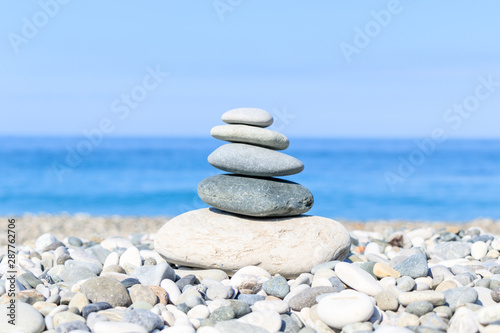 balance of stones on the background of the sea on the pebble plan  the concept of harmony and relaxation  close-up.