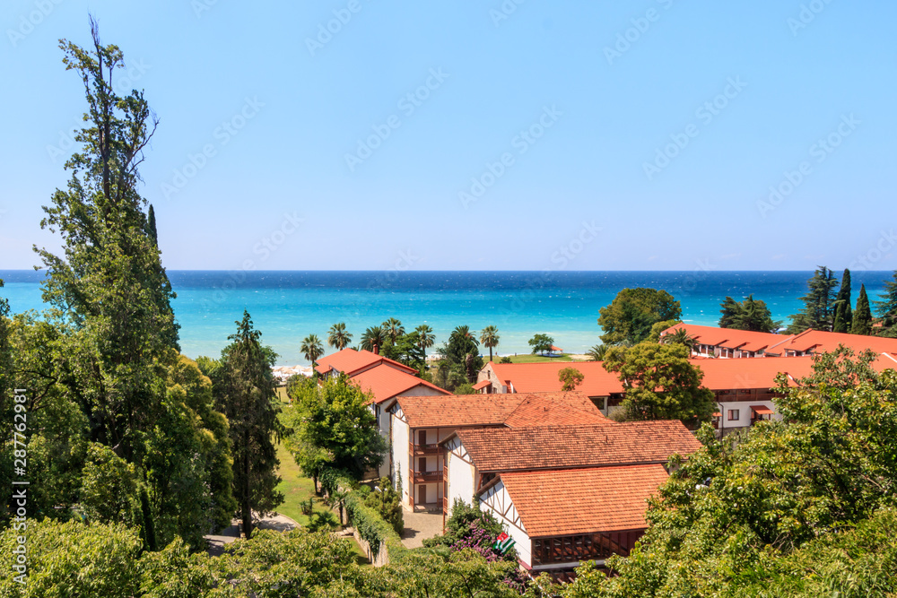 beautiful view of the blue ocean and houses with red tiles