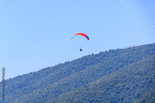 flight with an instructor on a paraglider over the mountains.