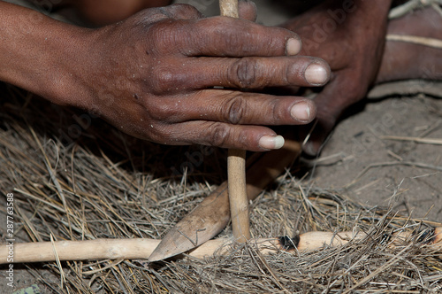 Bushman making fire in Africa