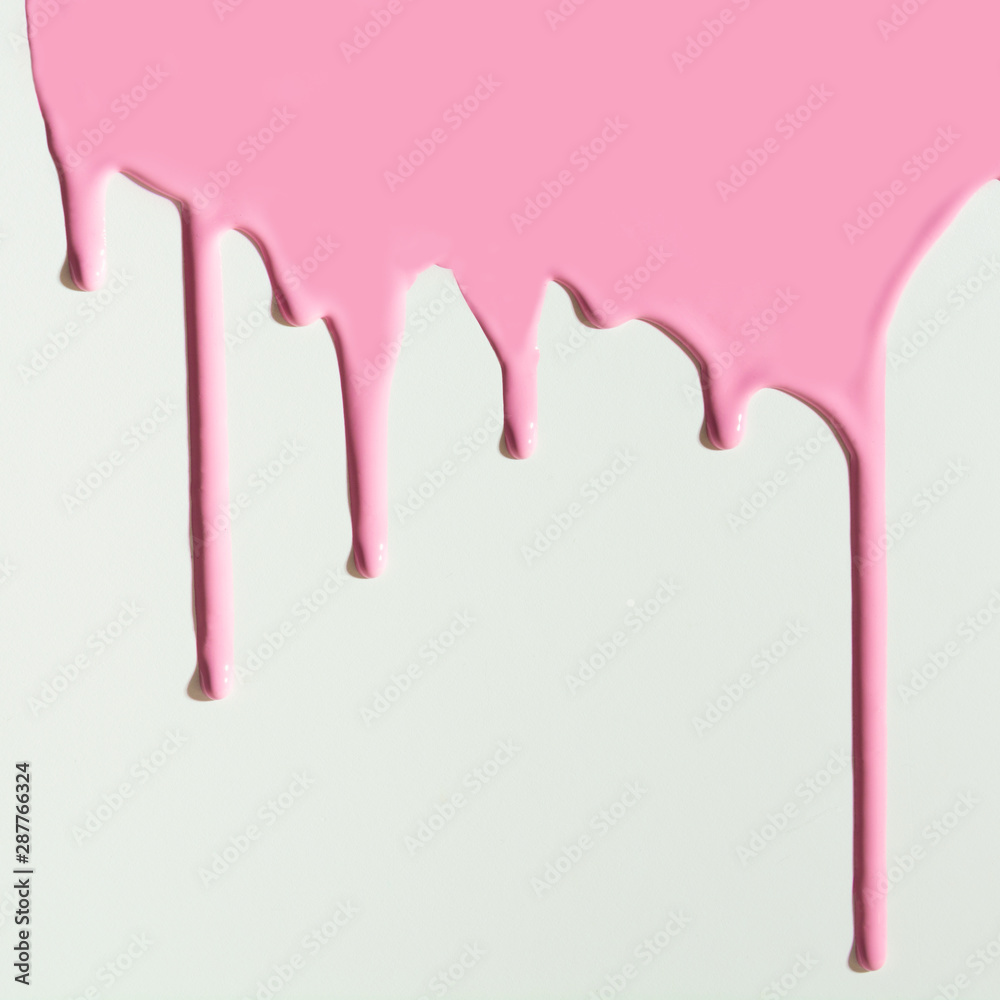 Pouring pink paint on white background. Creative pattern with copy space.