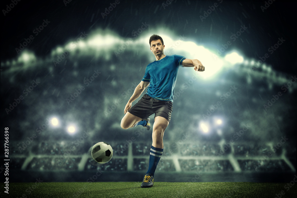 Soccer player in action on night stadium background