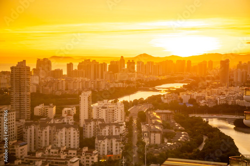 Aerial view of Sanya city with river at sunset light, Hainan province, China