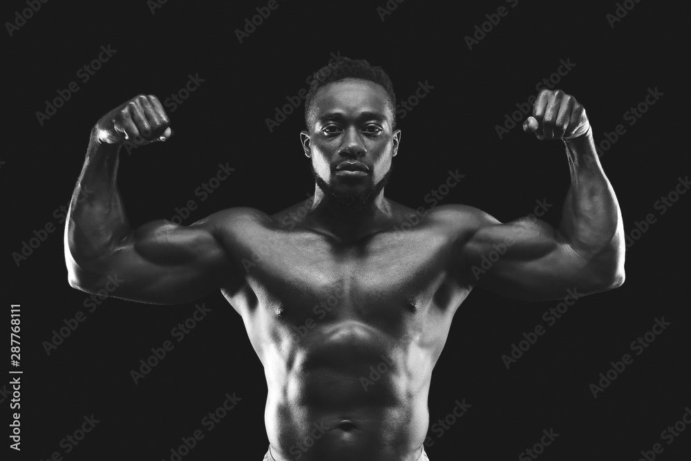 African american bodybuilder showing his strong muscular body