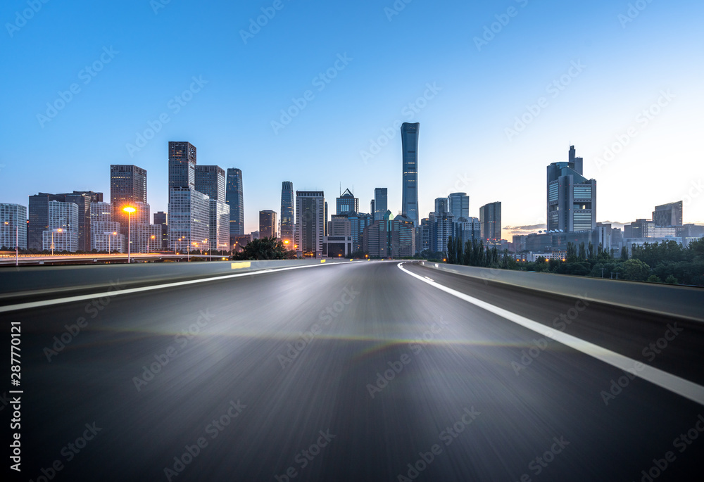 empty road with city skyline