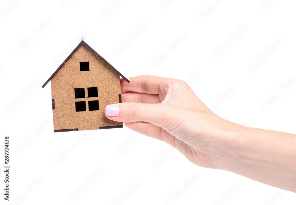 Wooden small house in hand on white background isolation Wooden small house in hand on white background isolation
