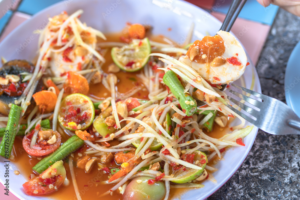 Papaya salad or what we called in Thai Som Tum the popular Thai style local the eastern delicious food of Thailand